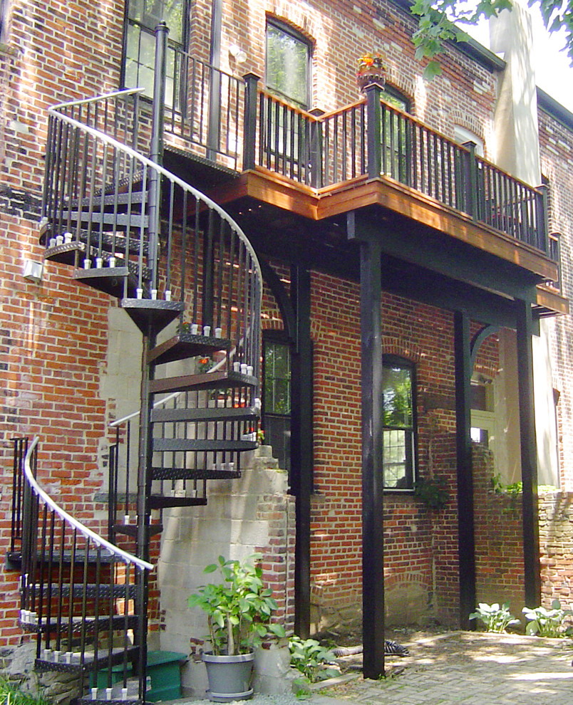 Inspiration for a mid-sized timeless brown two-story brick exterior home remodel in Philadelphia