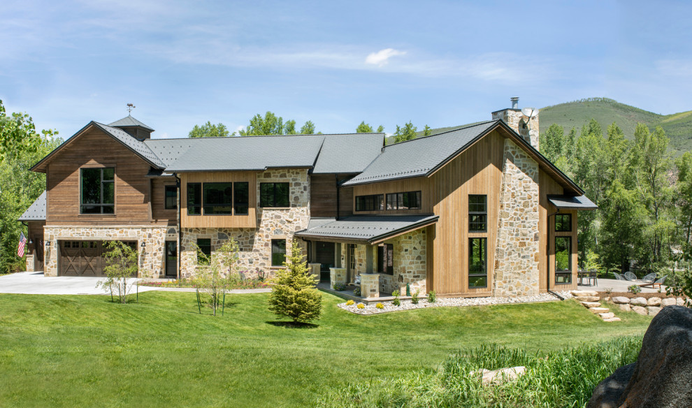 Example of a cottage exterior home design in Denver