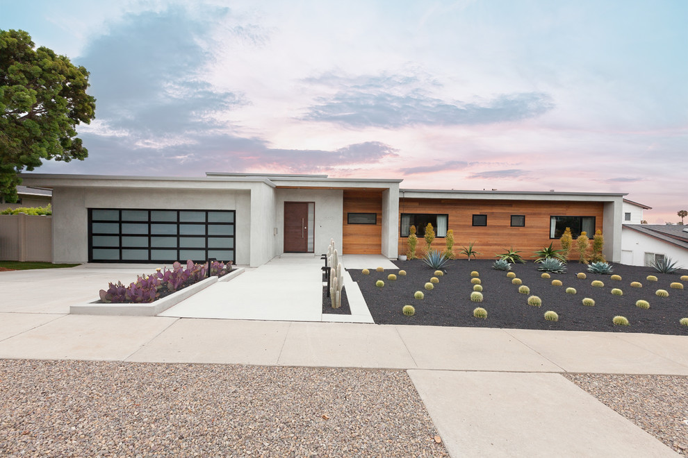 Modelo de fachada de casa multicolor contemporánea de tamaño medio con revestimientos combinados y tejado plano