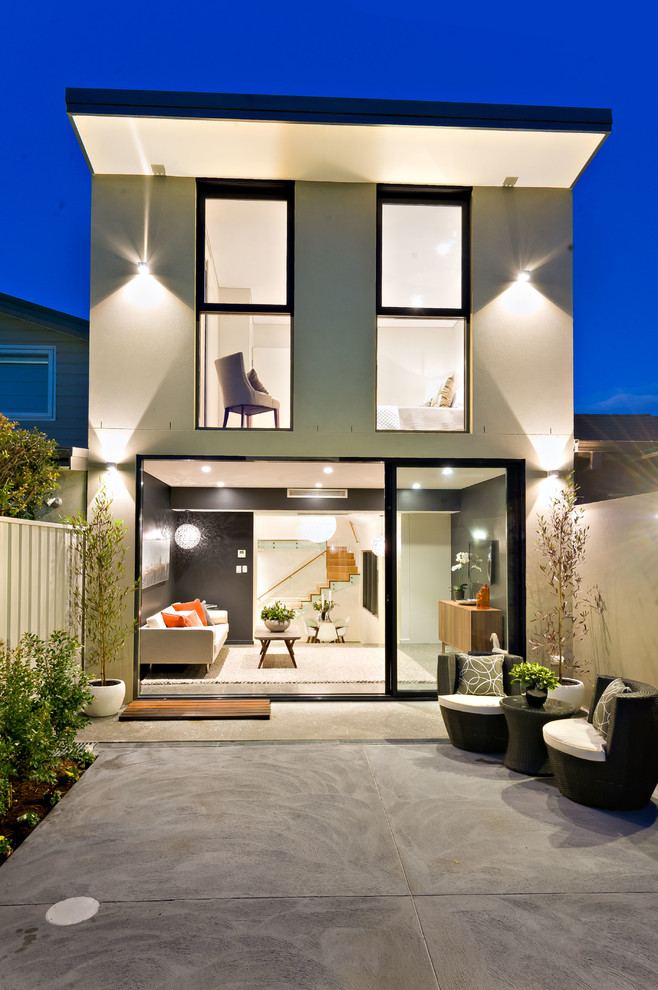 Inspiration for a gey contemporary two floor house exterior in Sydney with a flat roof.