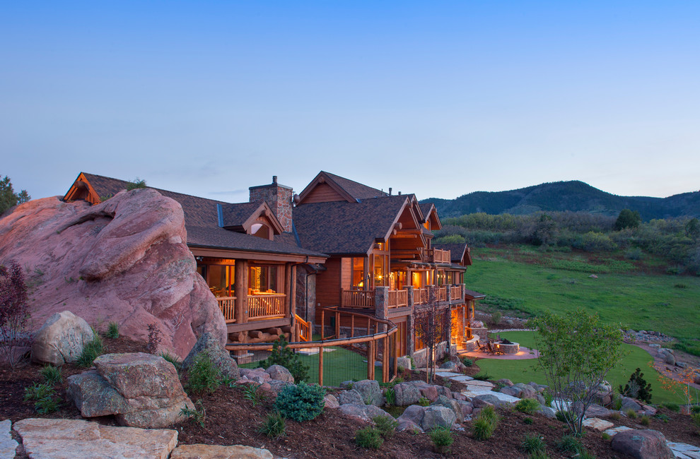 Example of a large mountain style brown two-story wood exterior home design in Denver with a shingle roof