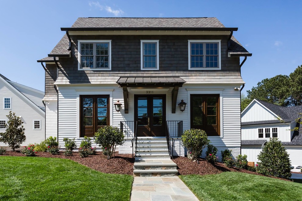 Inspiration for a large rustic white two-story mixed siding exterior home remodel in Salt Lake City with a shingle roof