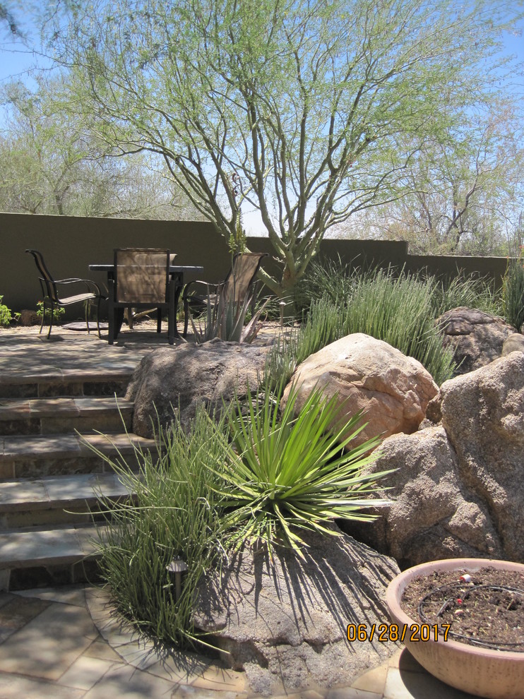 This is an example of a large contemporary split-level house exterior in Phoenix.