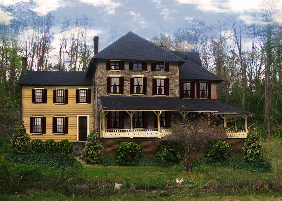На фото: трехэтажный, бежевый дом в стиле фьюжн с облицовкой из камня с