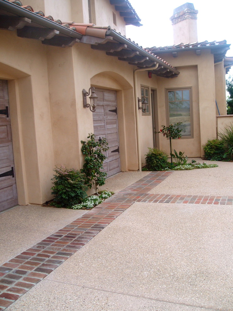 Example of a tuscan exterior home design in San Diego