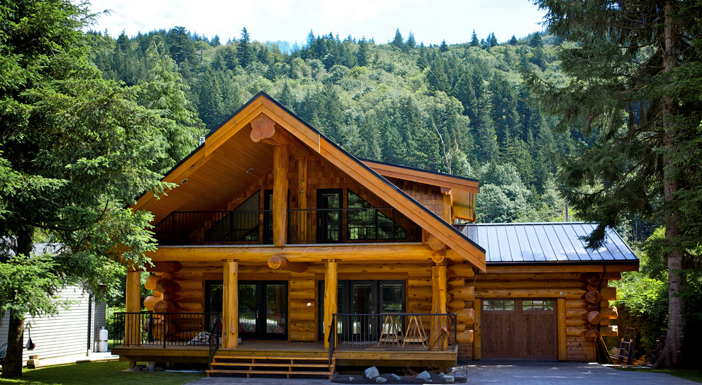 Example of a large mountain style two-story wood gable roof design in Vancouver