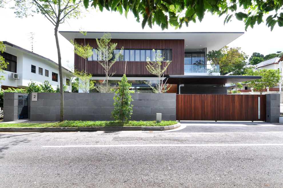Contemporary house exterior in Singapore with wood cladding.