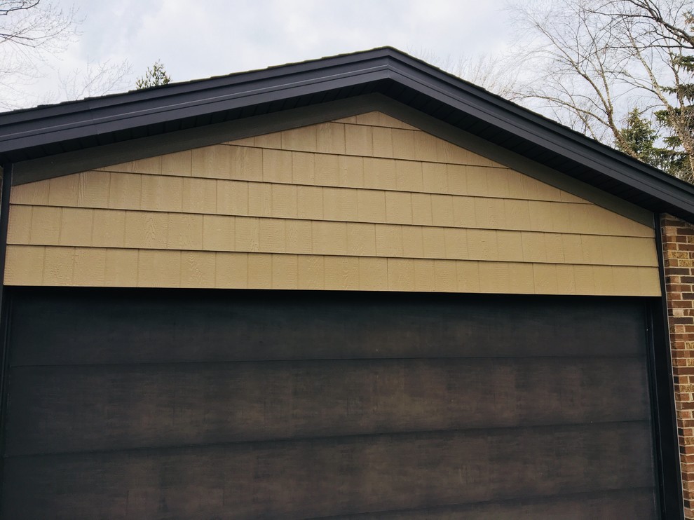 Diamond Kote siding, aluminum Dark bronze soffit and gutters House