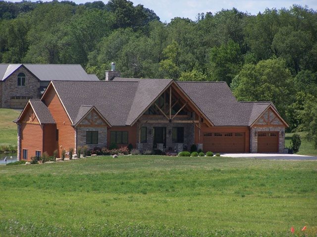 Example of a large mountain style brown two-story mixed siding exterior home design in Minneapolis