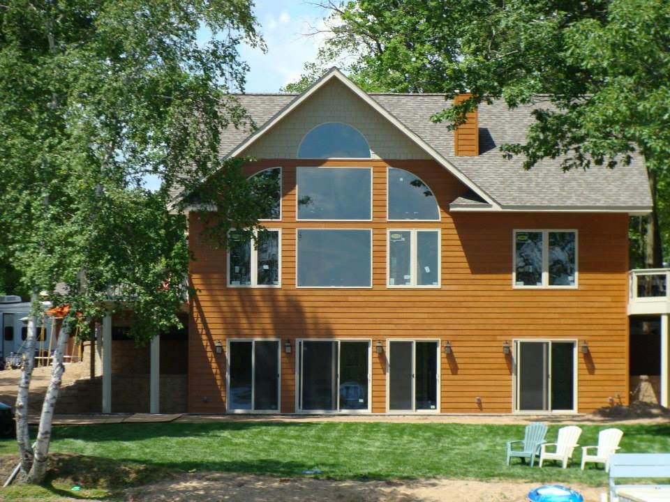 Example of a large trendy brown two-story exterior home design in Minneapolis
