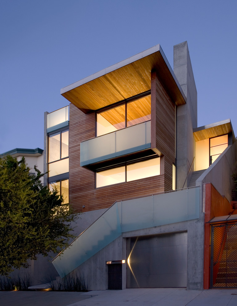 Inspiration for a large and brown modern house exterior in San Francisco with three floors, wood cladding and a lean-to roof.