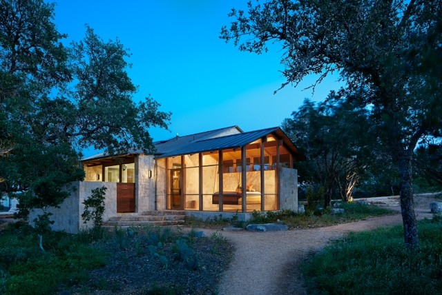 Example of a mid-sized one-story stone exterior home design in Austin
