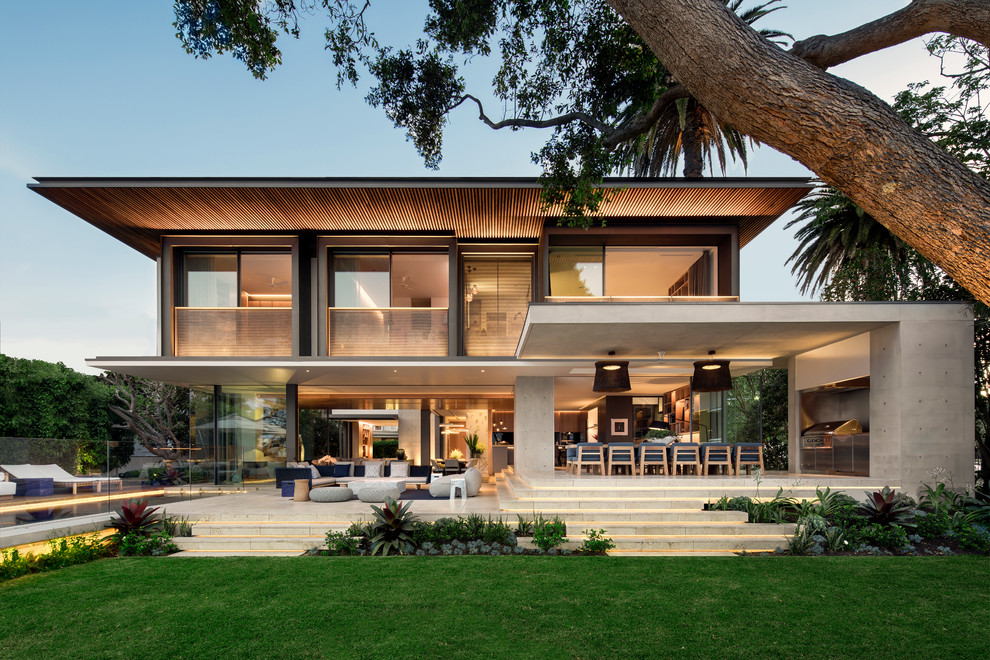 Zweistöckiges Modernes Einfamilienhaus mit Betonfassade, bunter Fassadenfarbe und Flachdach in Sydney