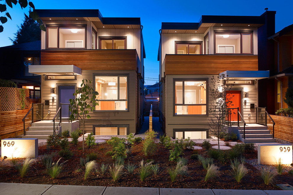 Inspiration for a small and gey modern two floor house exterior in Vancouver with concrete fibreboard cladding.