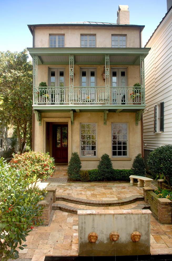Inspiration for a classic house exterior in Charleston with three floors.