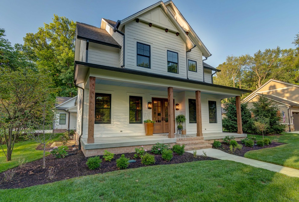 Inspiration for a craftsman beige two-story house exterior remodel in Indianapolis with a shingle roof