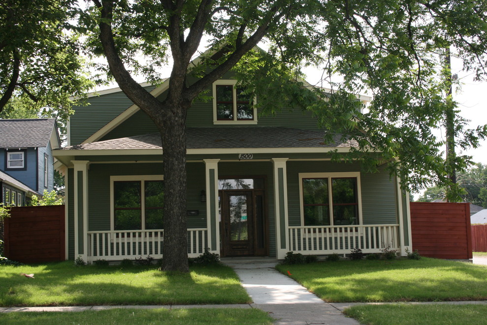 Inspiration for a medium sized and green classic two floor front house exterior in Dallas with vinyl cladding, a pitched roof, a shingle roof, a grey roof and shiplap cladding.