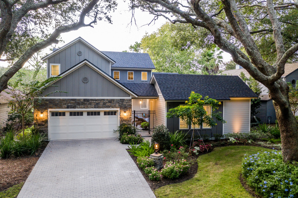 This is an example of a medium sized and gey rustic two floor detached house in Jacksonville with concrete fibreboard cladding, a pitched roof and a shingle roof.