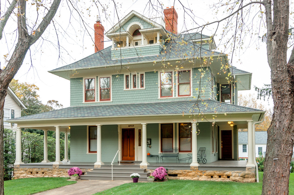 This is an example of a green victorian house exterior in DC Metro with three floors.