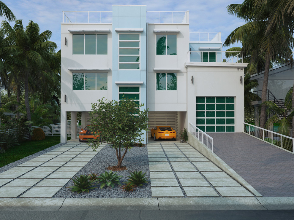 Large and white modern render detached house in Miami with three floors and a flat roof.