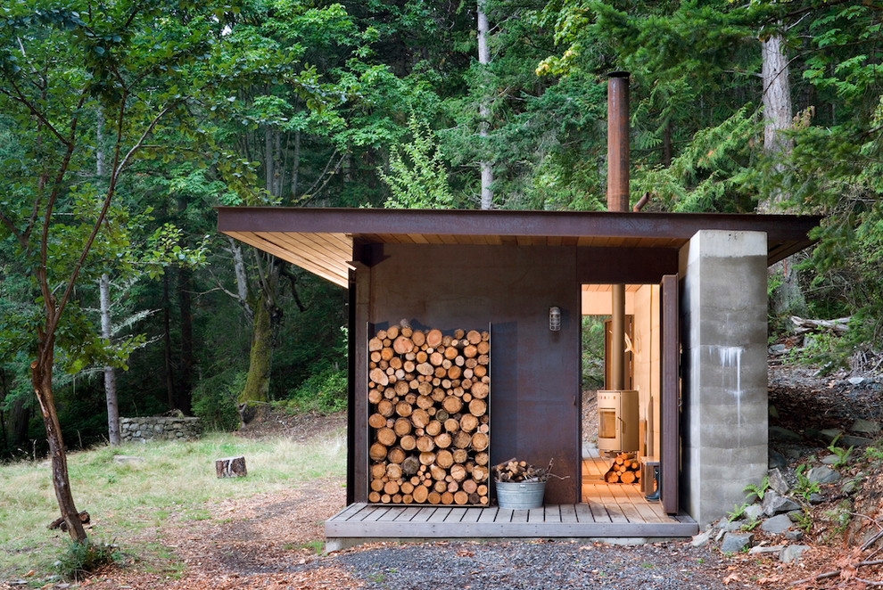 Inspiration for a small rustic one-story exterior home remodel in Vancouver with a shed roof