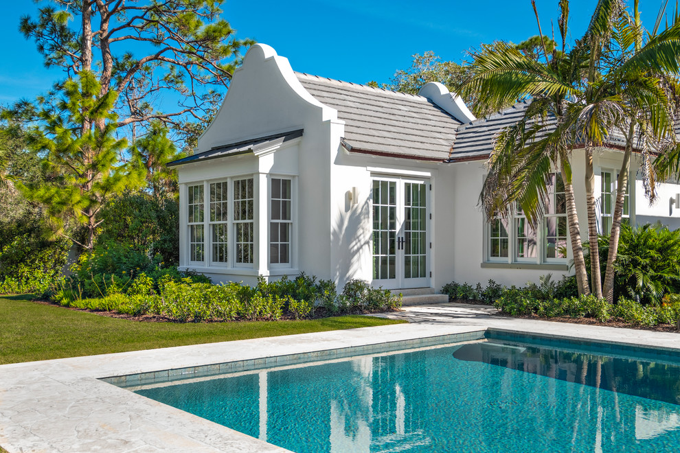 Example of an island style exterior home design in Miami