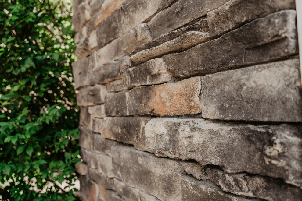 Dutch Lap Seamless Siding with Stone Accents Traditional Exterior