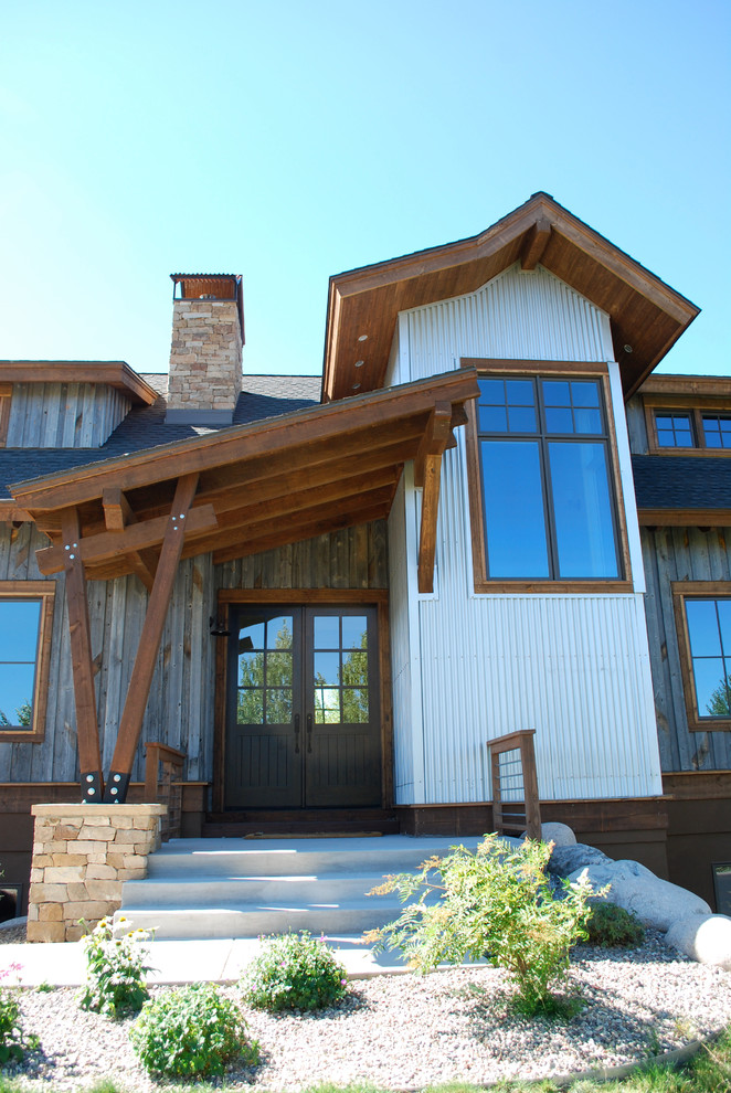 This is an example of a contemporary house exterior in Denver with metal cladding.
