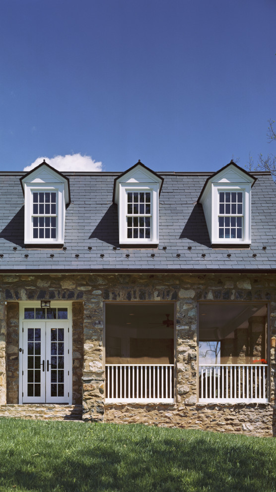 Mid-sized farmhouse beige three-story stone exterior home photo in DC Metro with a shingle roof