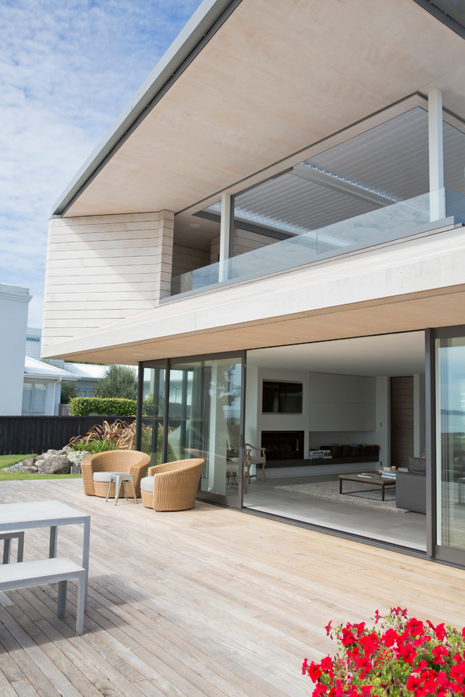 Trendy wood exterior home photo in Auckland