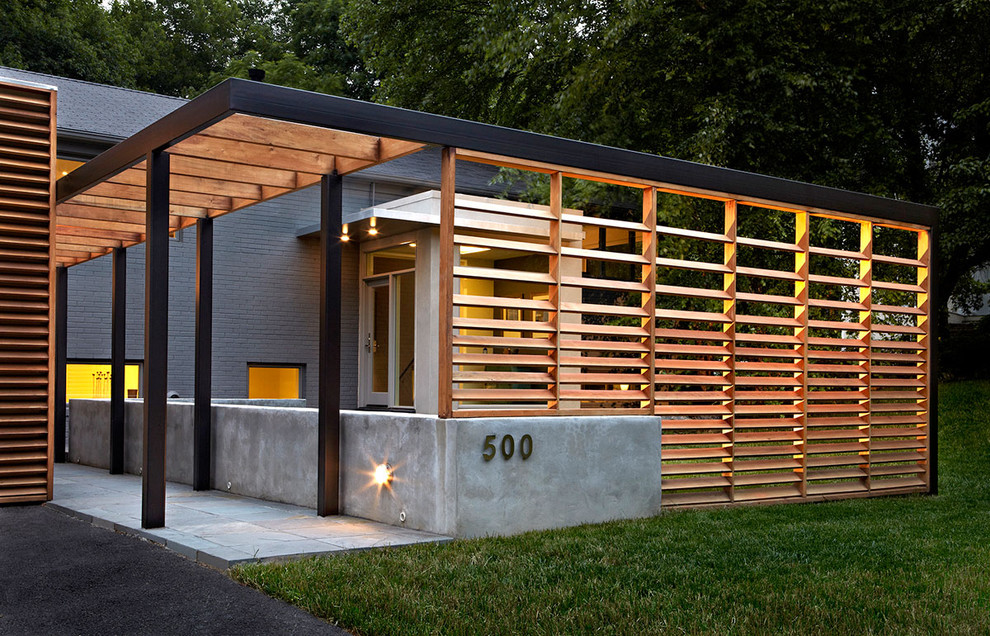 Trendy brick exterior home photo in DC Metro
