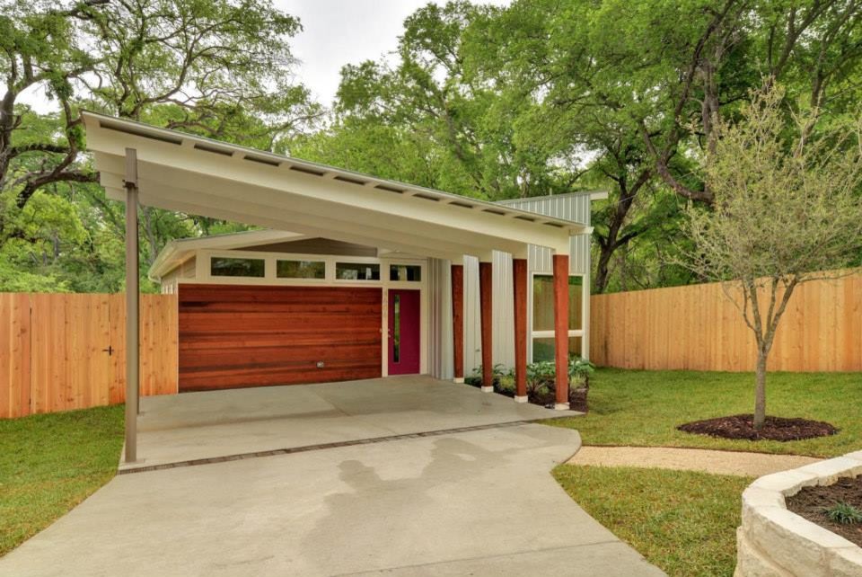 Mid-sized minimalist gray one-story metal exterior home photo in Austin with a shed roof