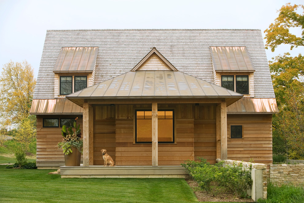Inspiration for a rustic wood exterior home remodel in Burlington