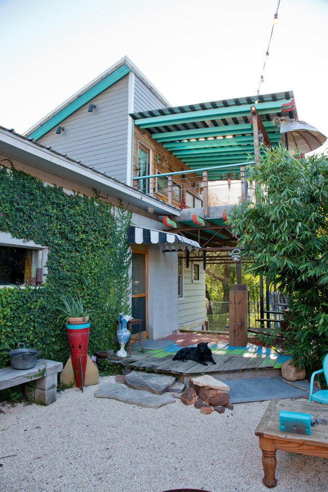 Example of an eclectic two-story exterior home design in Austin