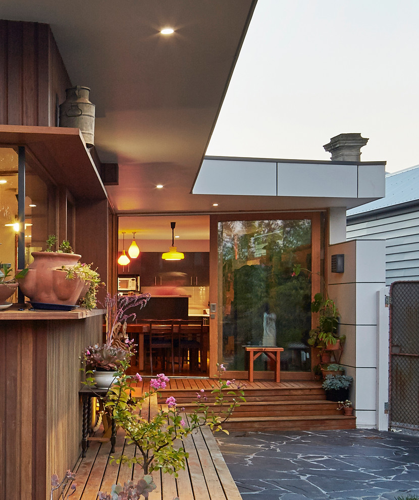 Mid-sized trendy white one-story wood flat roof photo in Melbourne