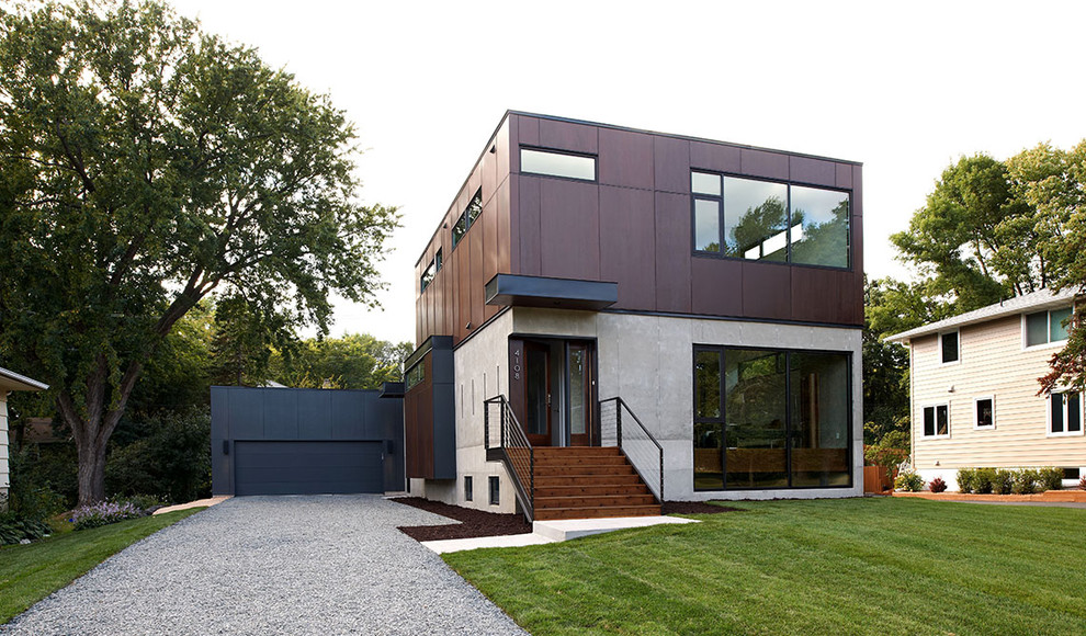 Idées déco pour une façade de maison moderne en béton de taille moyenne et à un étage avec un toit plat.