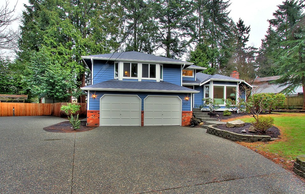Inspiration for a transitional blue split-level wood exterior home remodel in Seattle