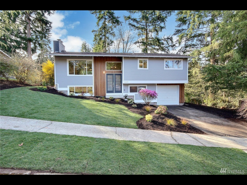 Example of a 1960s exterior home design in Seattle