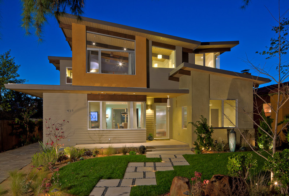 Design ideas for a contemporary two floor house exterior in Los Angeles with a butterfly roof.
