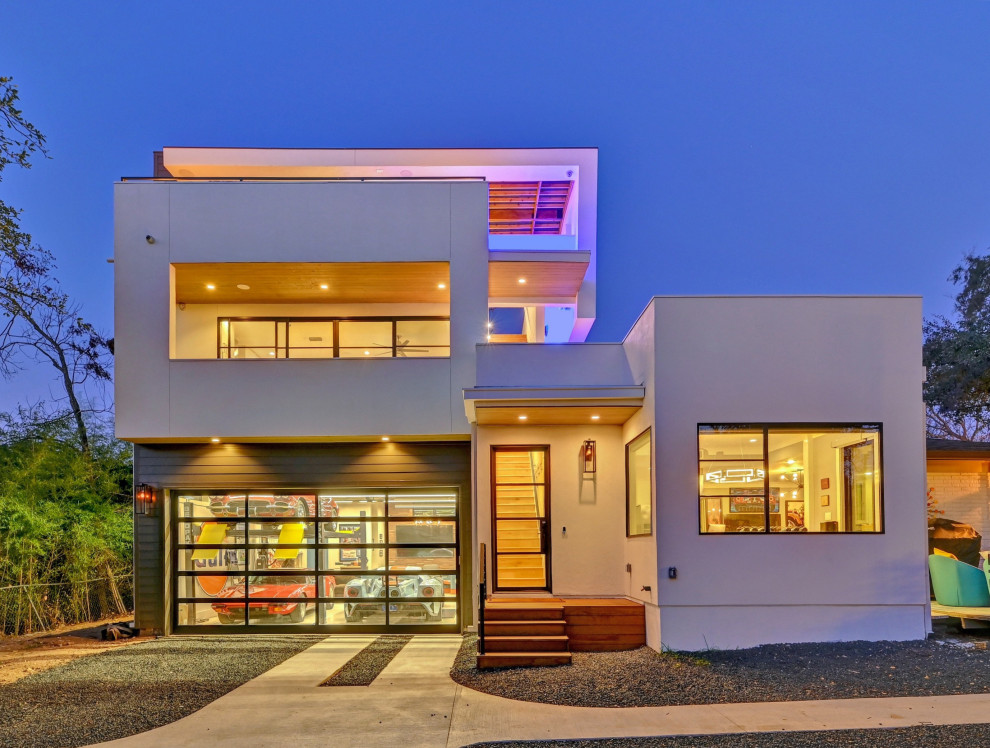 Contemporary white exterior home idea in Austin