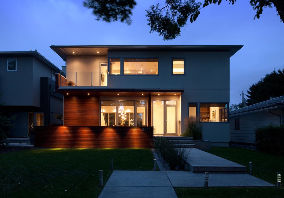 Mid-sized modern multicolored two-story mixed siding exterior home idea in Calgary with a shingle roof