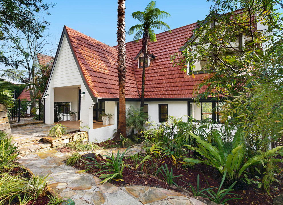 Mid-sized transitional white two-story brick exterior home idea in Sydney with a tile roof