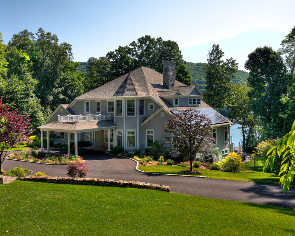 Design ideas for a gey and large traditional two floor house exterior in New York with wood cladding and a hip roof.