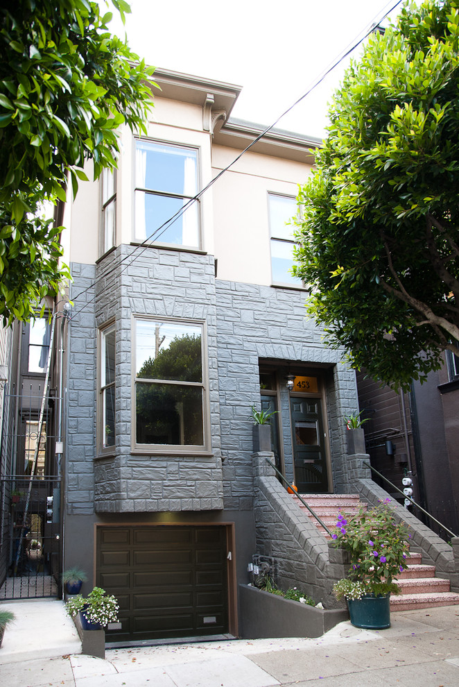 Example of a classic two-story stone house exterior design in San Francisco