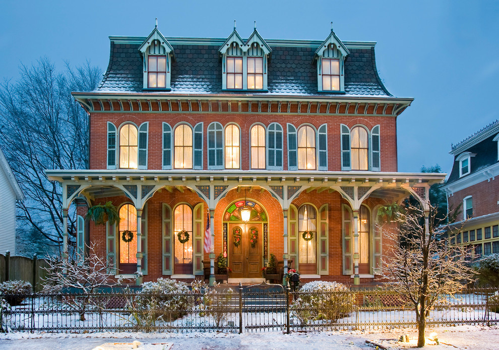 Large victorian three-story brick exterior home idea in Philadelphia