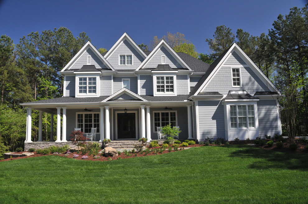 Design ideas for a large and gey traditional two floor house exterior in Raleigh with mixed cladding.