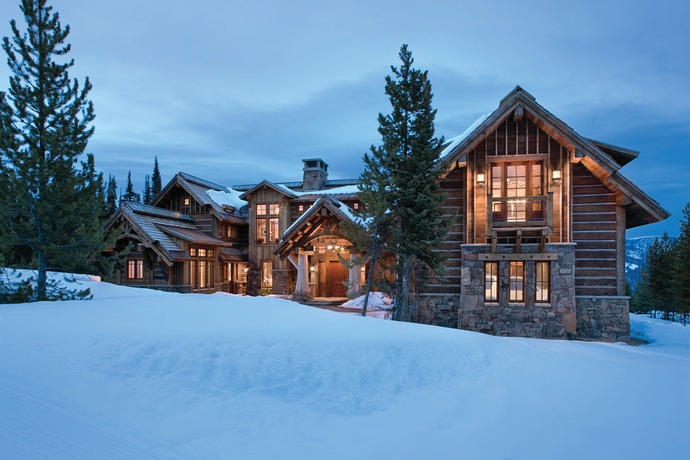 Example of a mountain style stone exterior home design in Other