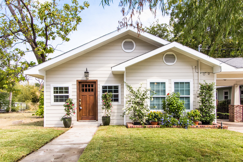 Inspiration for a timeless beige gable roof remodel in Dallas