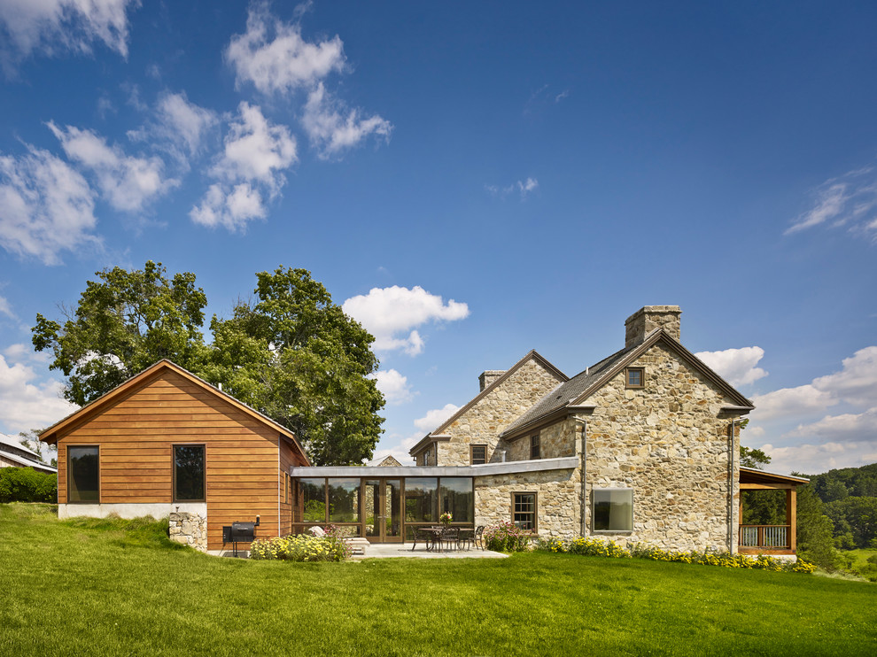 Inspiration for a farmhouse stone exterior home remodel in Philadelphia