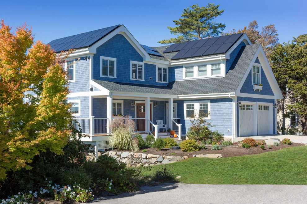 Inspiration for a mid-sized timeless blue two-story mixed siding gable roof remodel in Providence